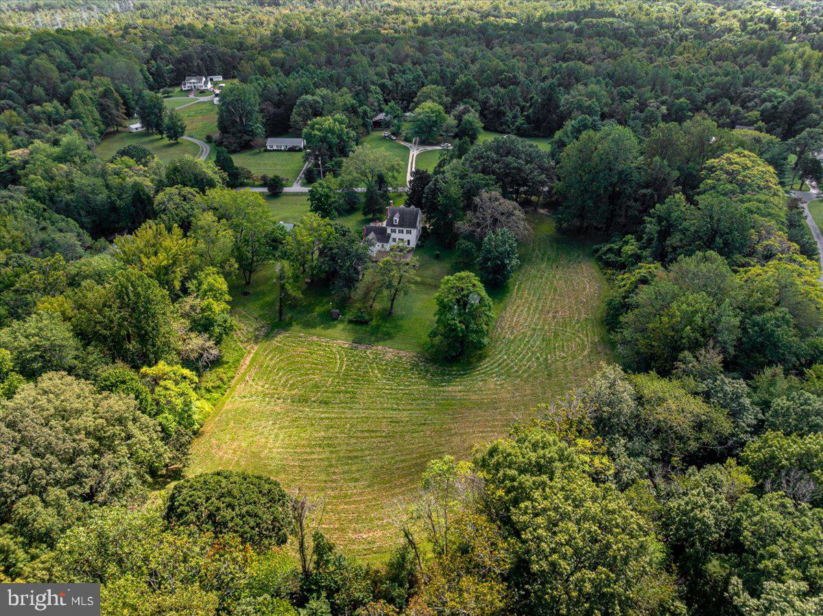 16410 St Marys Church Road Aquasco, MD 20608 - Photo 13 of 64 an aerial view of residential houses with outdoor space and trees all around