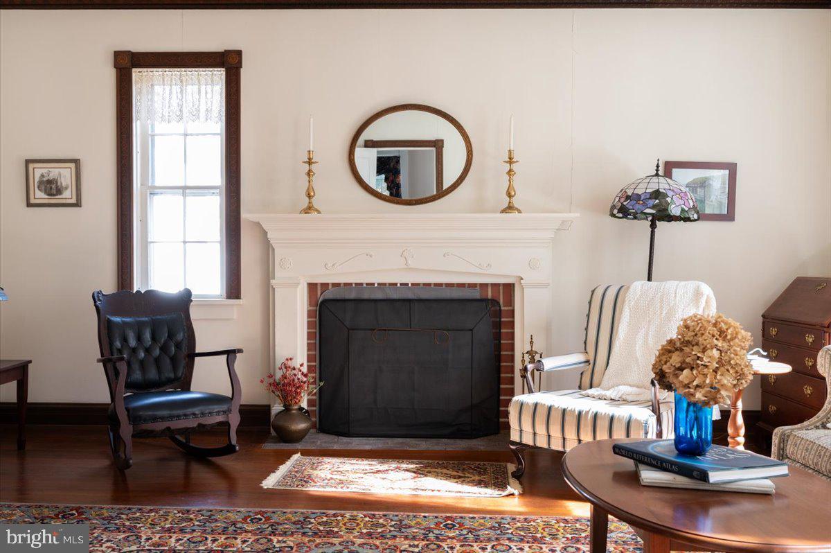 16410 St Marys Church Road Aquasco, MD 20608 - Photo 24 of 64 a living room with furniture a window and a fireplace