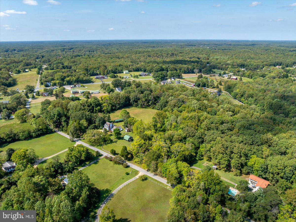 16410 St Marys Church Road Aquasco, MD 20608 - Photo 7 of 64 an aerial view of a houses with a yard