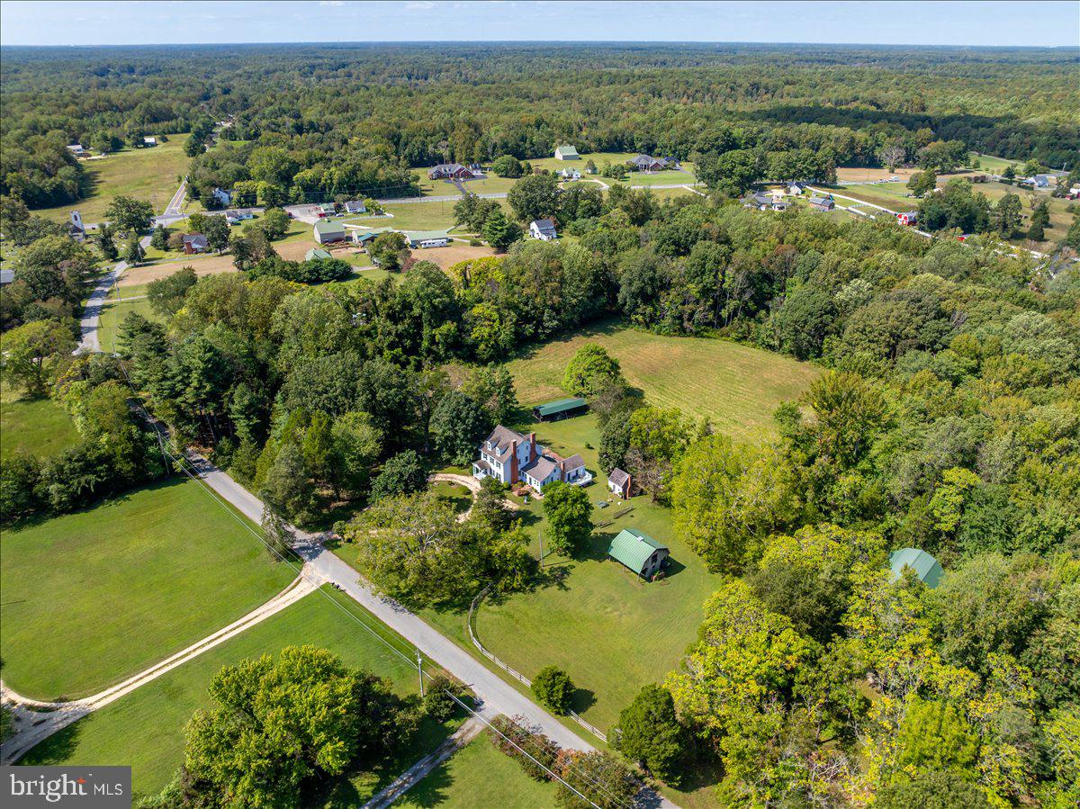 16410 St Marys Church Road Aquasco, MD 20608 - Photo 8 of 64 an aerial view of residential houses with outdoor space and trees all around