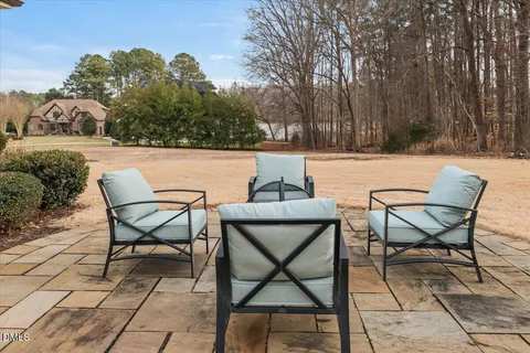 a view of a chairs and tables in the patio