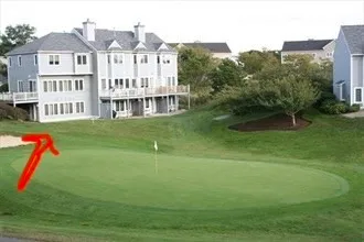 a view of a big yard next to a house