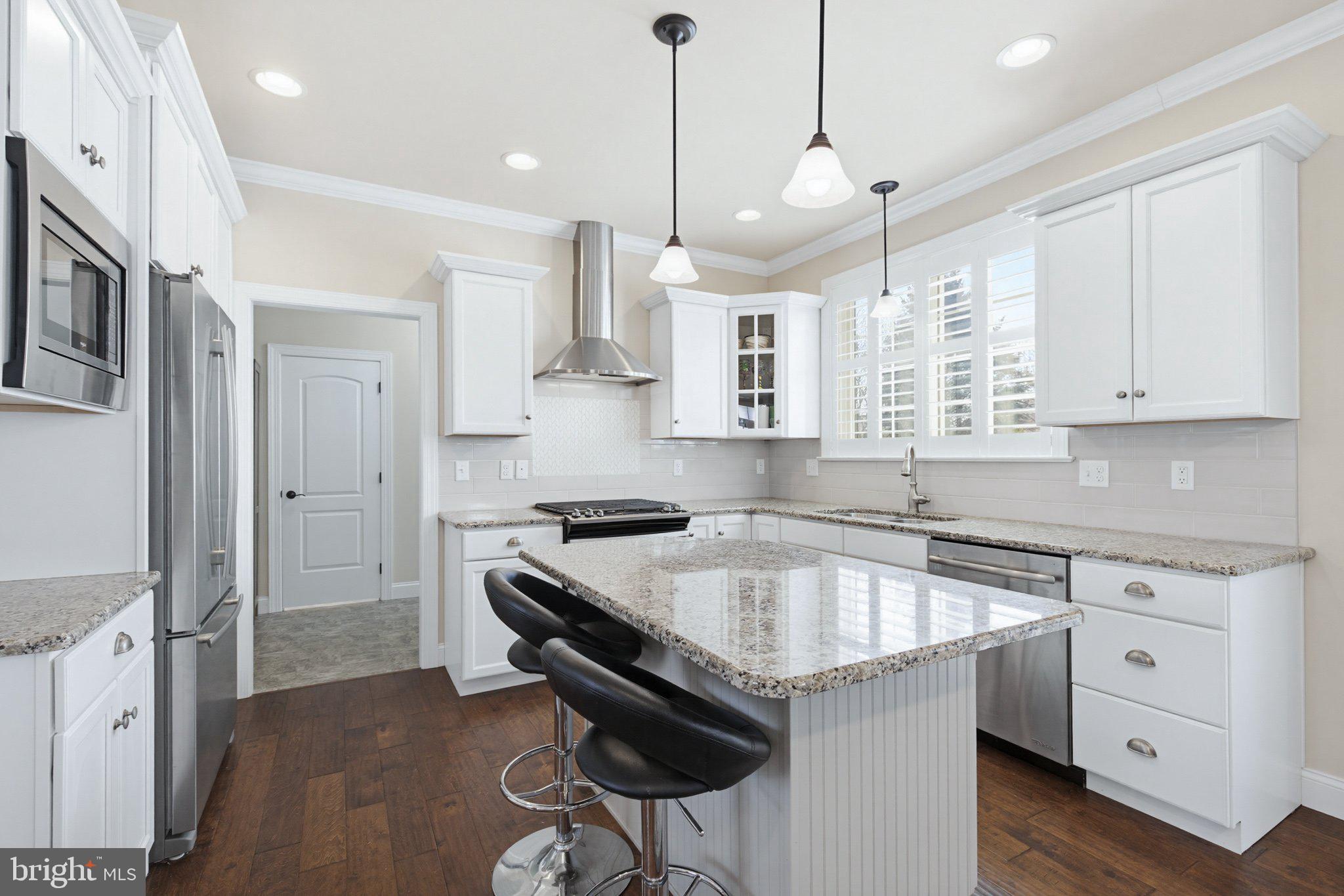 1021 Suffolk Drive Lititz, PA 17543 - Photo 12 of 44 a kitchen with stainless steel appliances granite countertop a sink stove and refrigerator