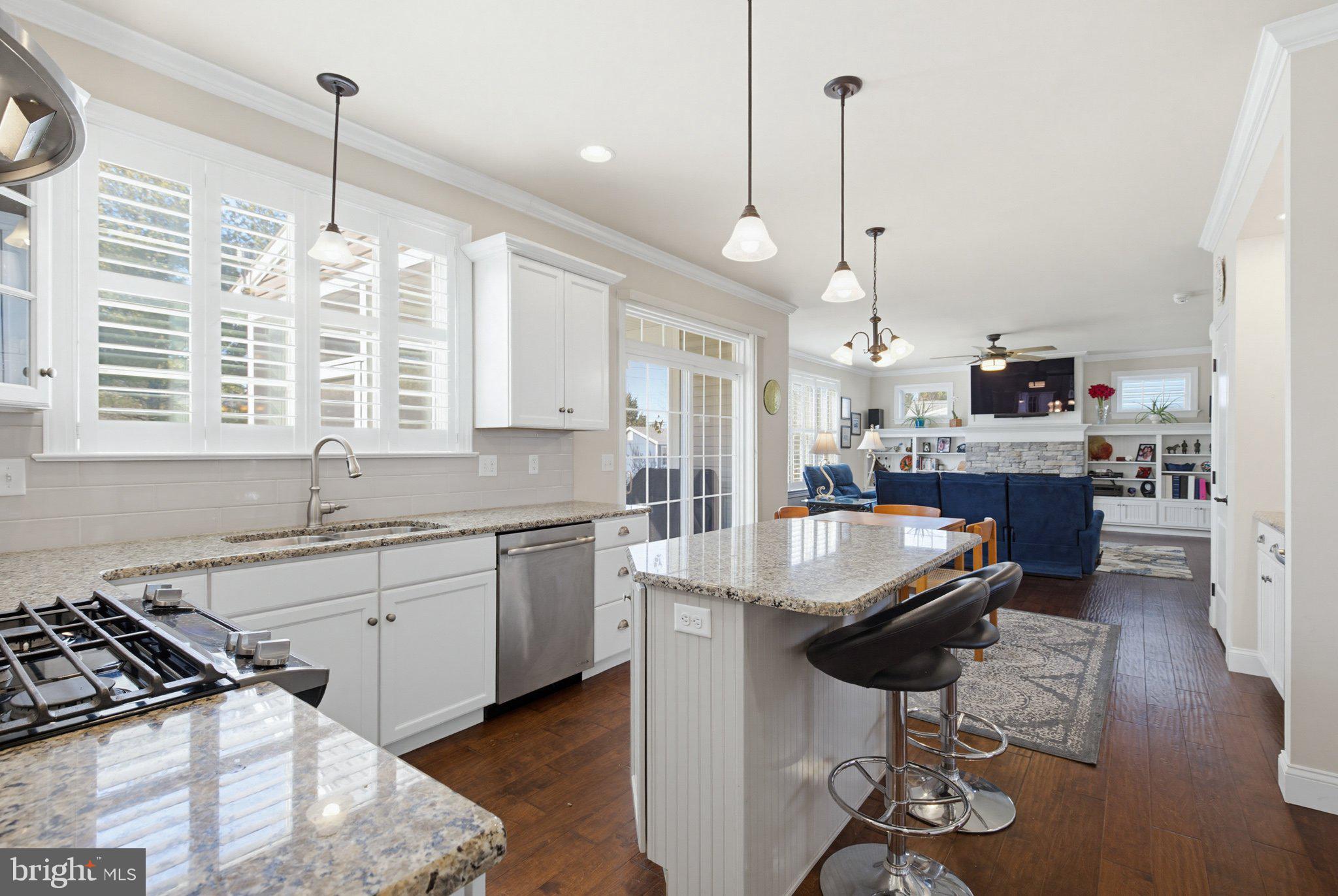 1021 Suffolk Drive Lititz, PA 17543 - Photo 13 of 44 a kitchen with stainless steel appliances granite countertop a stove oven and a wooden cabinets