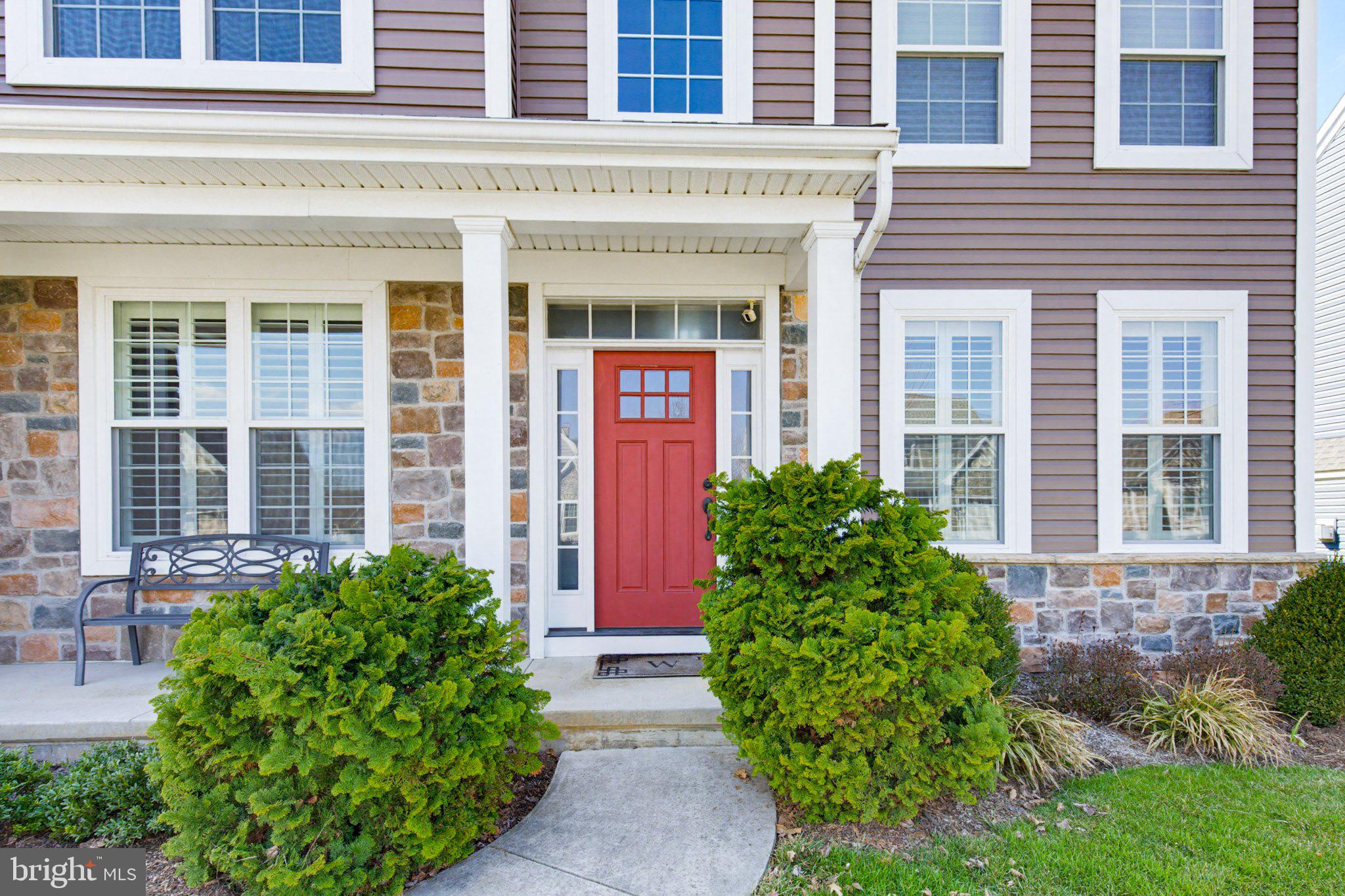 1021 Suffolk Drive Lititz, PA 17543 - Photo 2 of 44 front view of a brick house with a large window