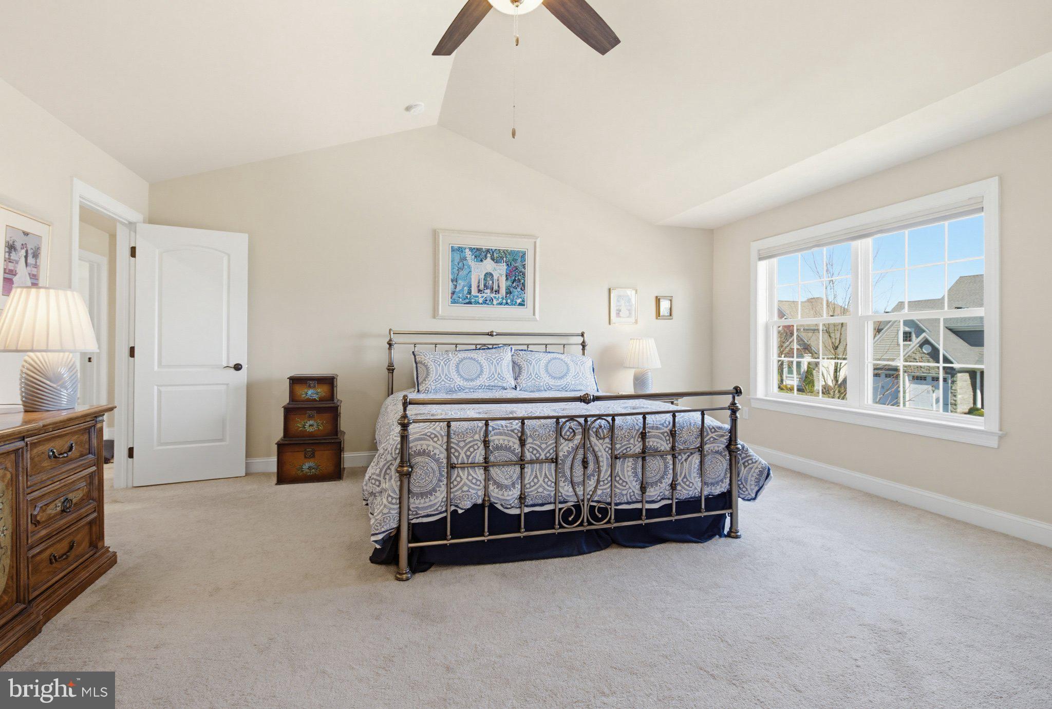 1021 Suffolk Drive Lititz, PA 17543 - Photo 21 of 44 a bedroom with a bed and a chandelier