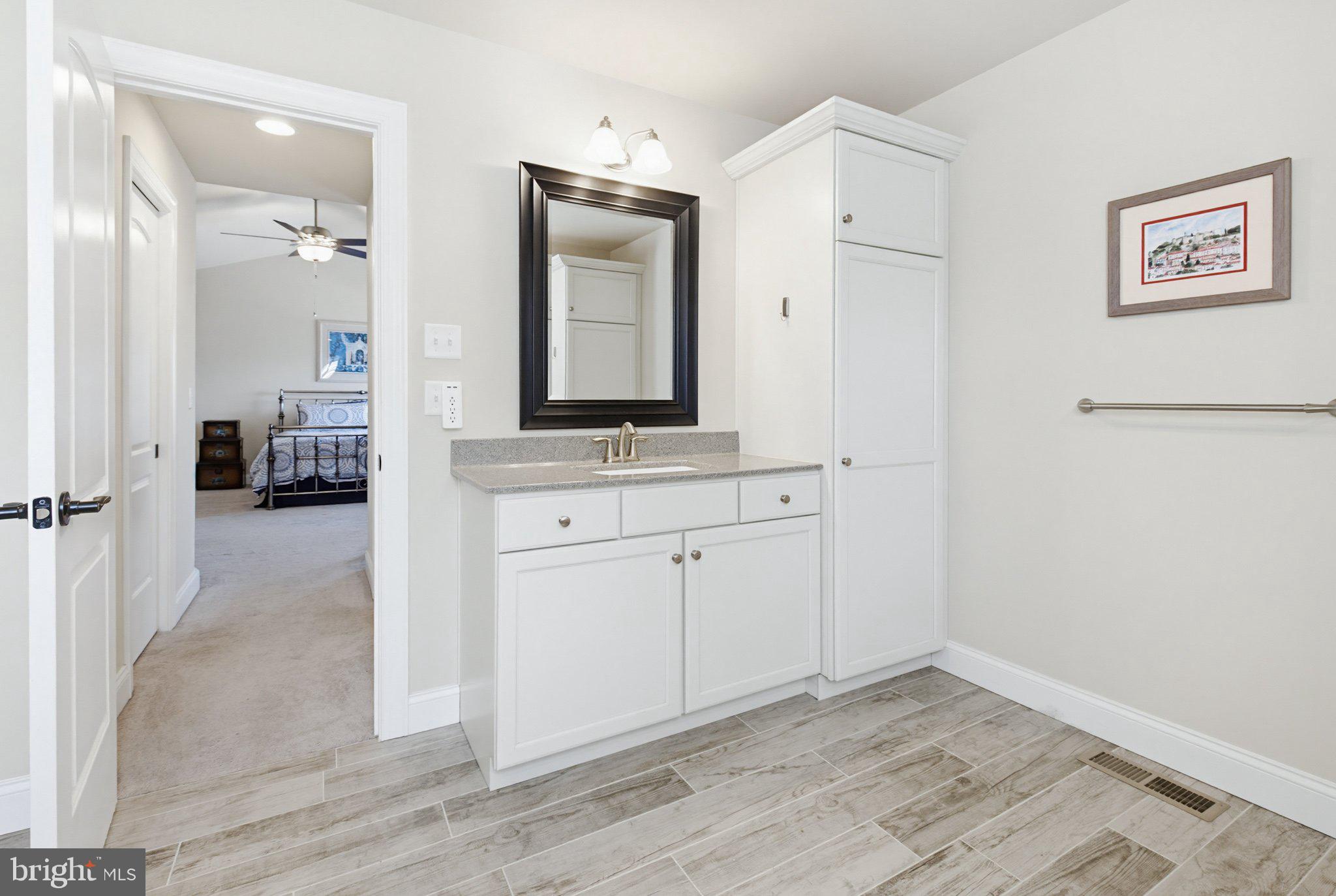 1021 Suffolk Drive Lititz, PA 17543 - Photo 23 of 44 a view of cabinets with wooden floor and white cabinet
