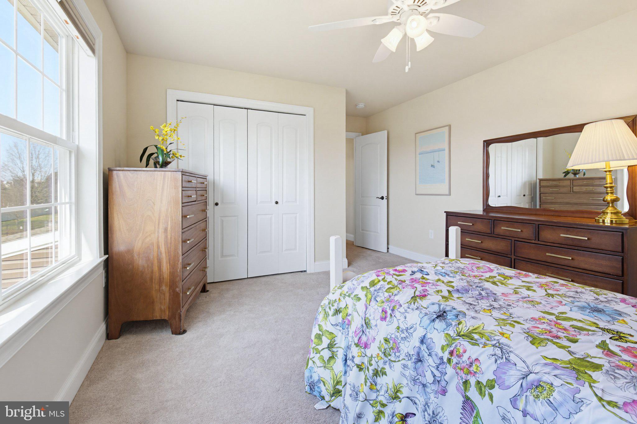 1021 Suffolk Drive Lititz, PA 17543 - Photo 26 of 44 a bedroom with a bed and a chandelier