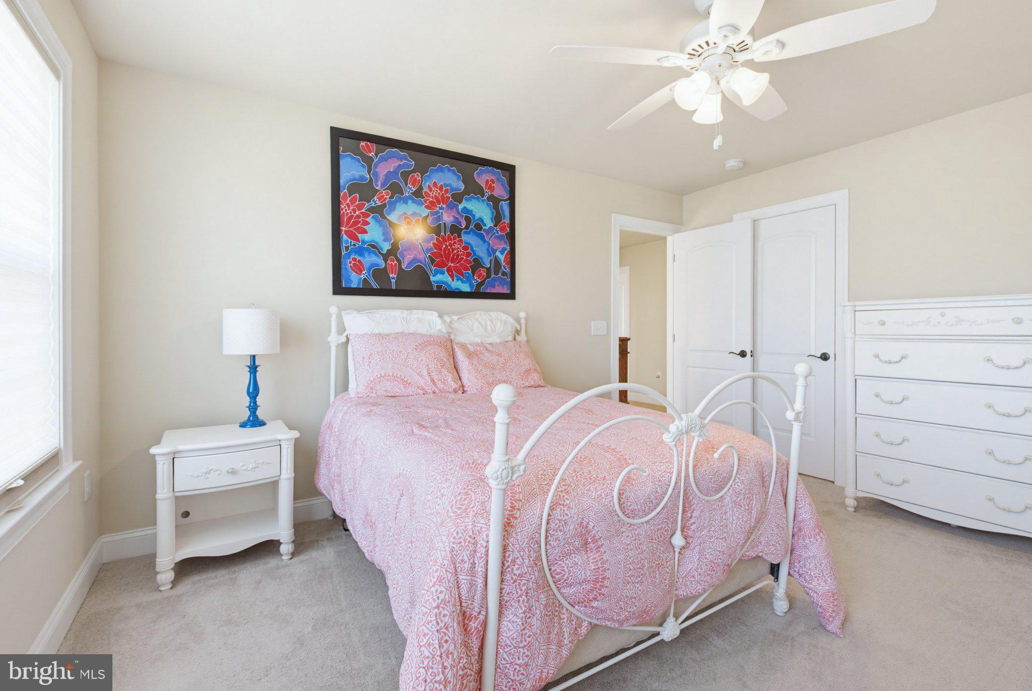 1021 Suffolk Drive Lititz, PA 17543 - Photo 30 of 44 a bedroom with a bed and a chandelier