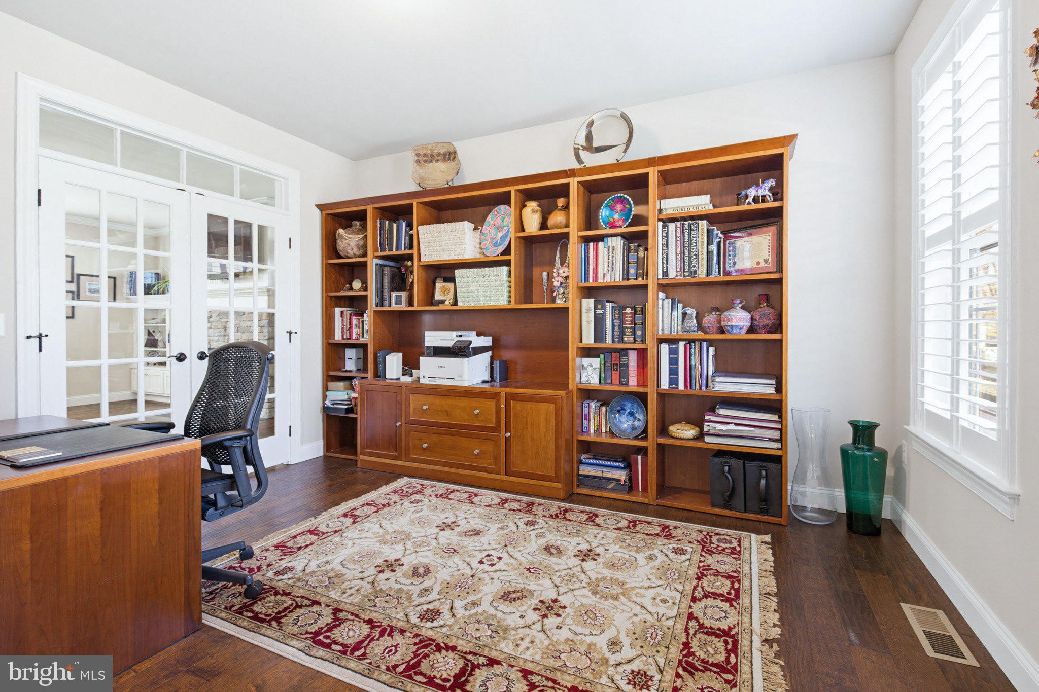 1021 Suffolk Drive Lititz, PA 17543 - Photo 7 of 44 a view of a workspace with bookshelf and a window