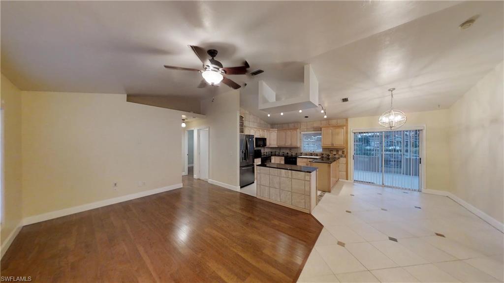 9108 Henry Road Fort Myers, FL 33967 - Photo 4 of 18 a view of a kitchen with a sink and a refrigerator