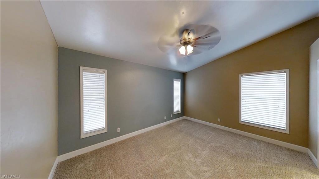 9108 Henry Road Fort Myers, FL 33967 - Photo 8 of 18 a view of an empty room with a window
