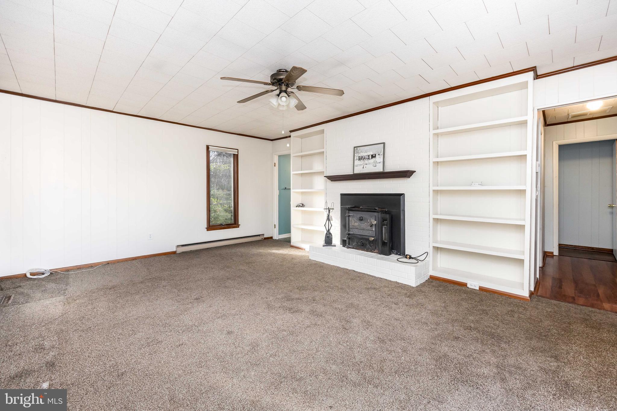 310 Zion Road Salisbury, MD 21804 - Photo 12 of 40 a view of an empty room with a fireplace