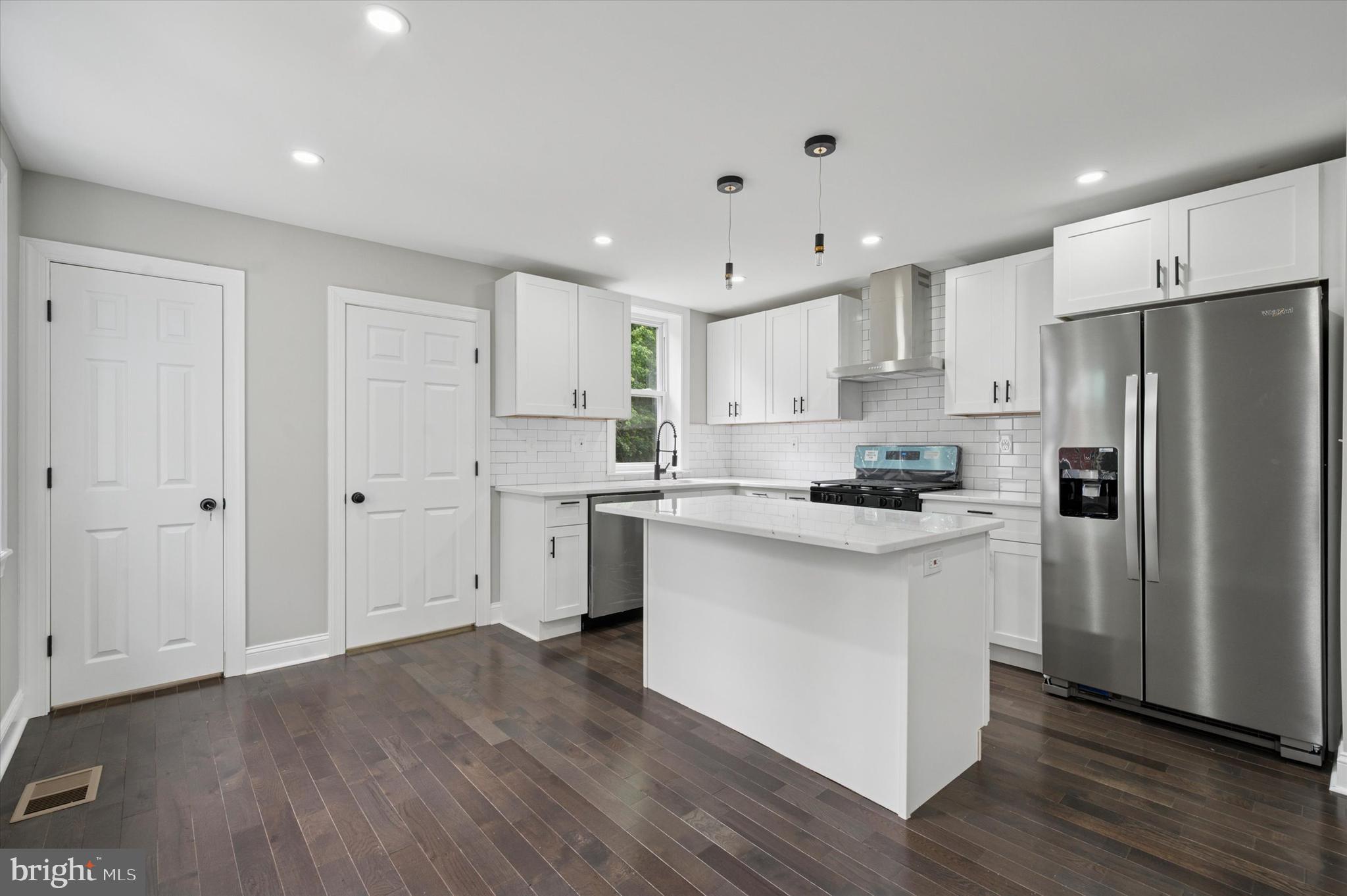 860 Rundale Avenue Lansdowne, PA 19050 - Photo 13 of 28 a kitchen with white cabinets and stainless steel appliances