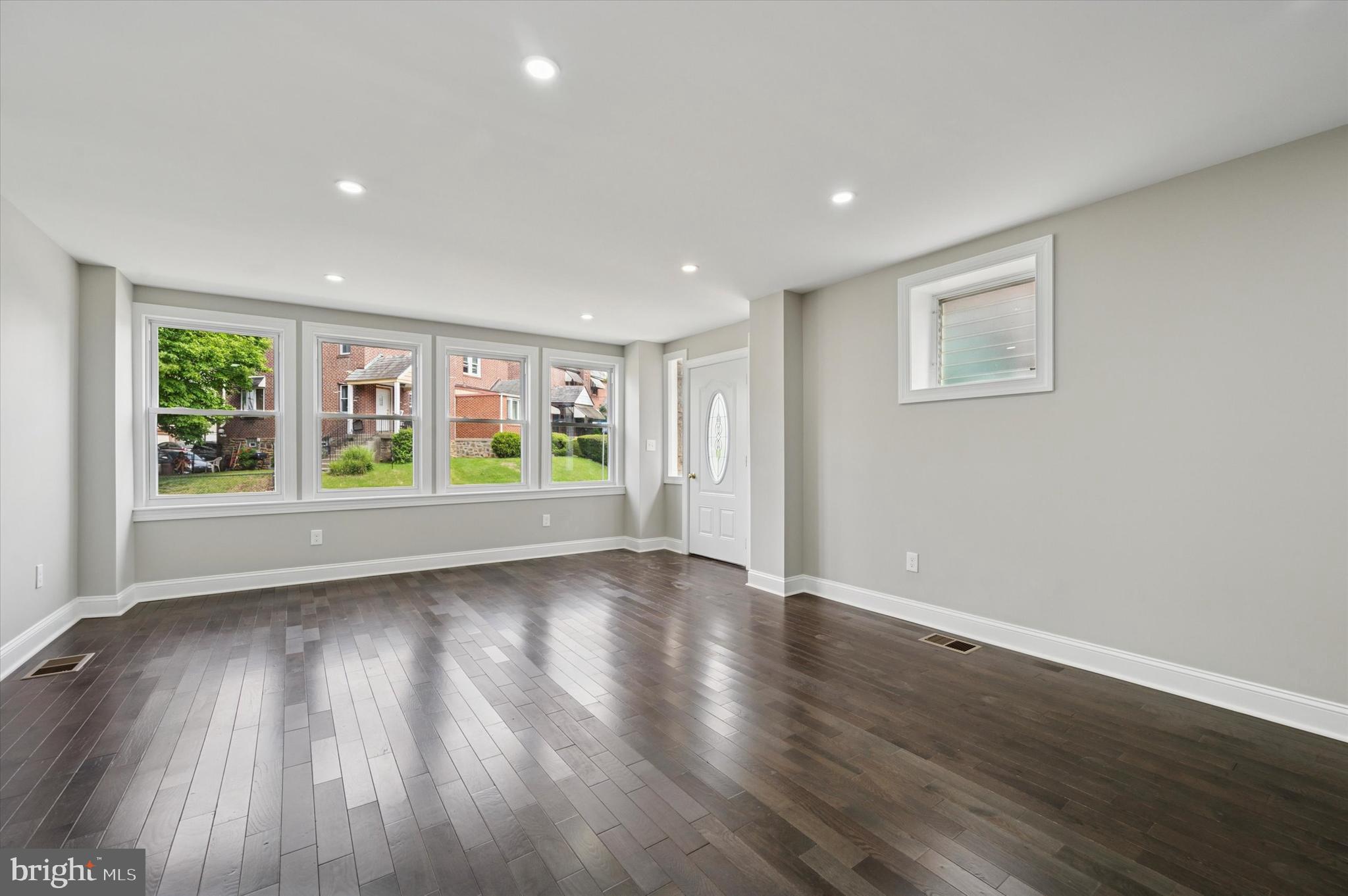 860 Rundale Avenue Lansdowne, PA 19050 - Photo 5 of 28 a view of an empty room with wooden floor and a window