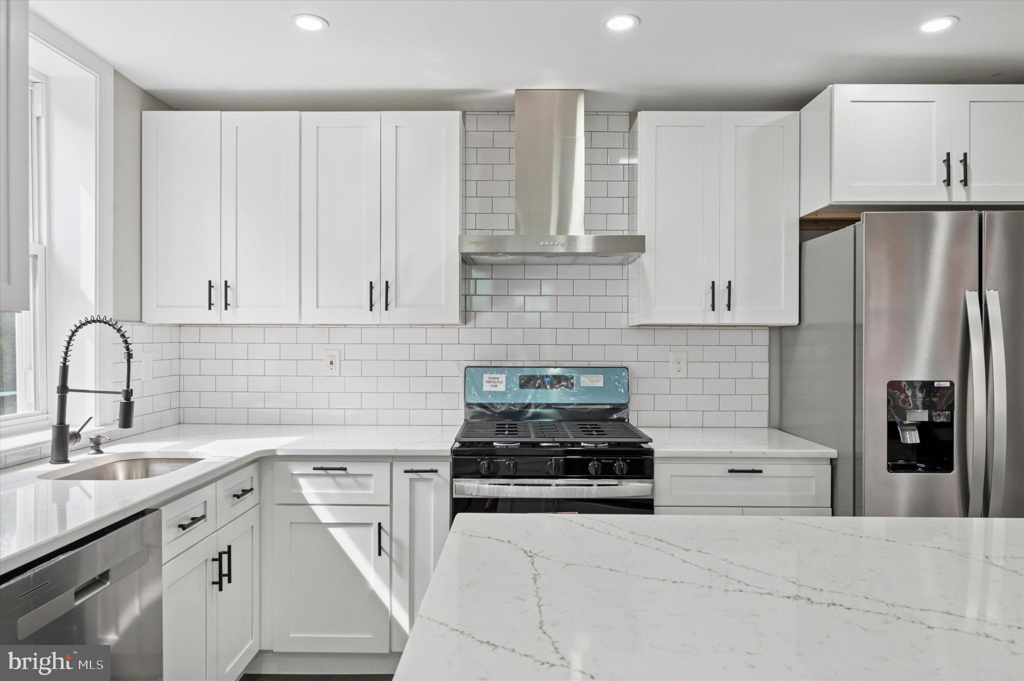 860 Rundale Avenue Lansdowne, PA 19050 - Photo 10 of 28 a kitchen with stainless steel appliances white cabinets and a sink
