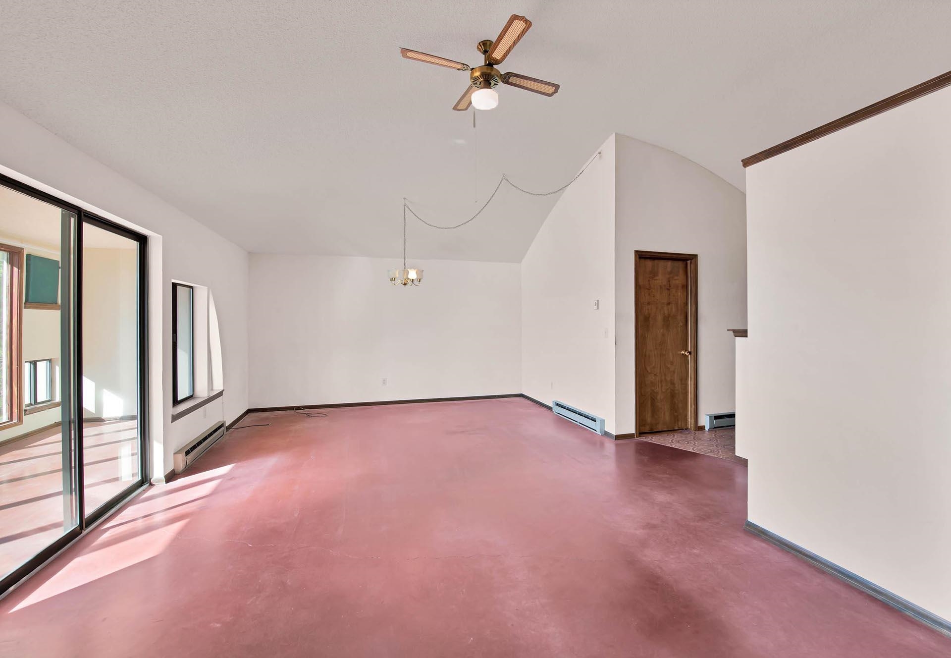 1041 South 16 1/2 Road Glade Park, CO 81523 - Photo 12 of 42 wooden floor in an empty room with a window