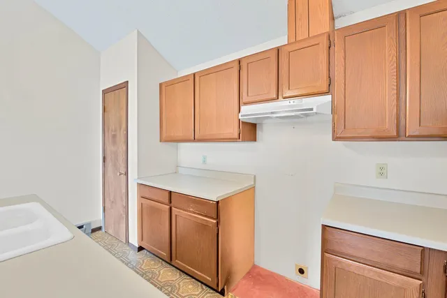 a bathroom with a sink a vanity and a mirror