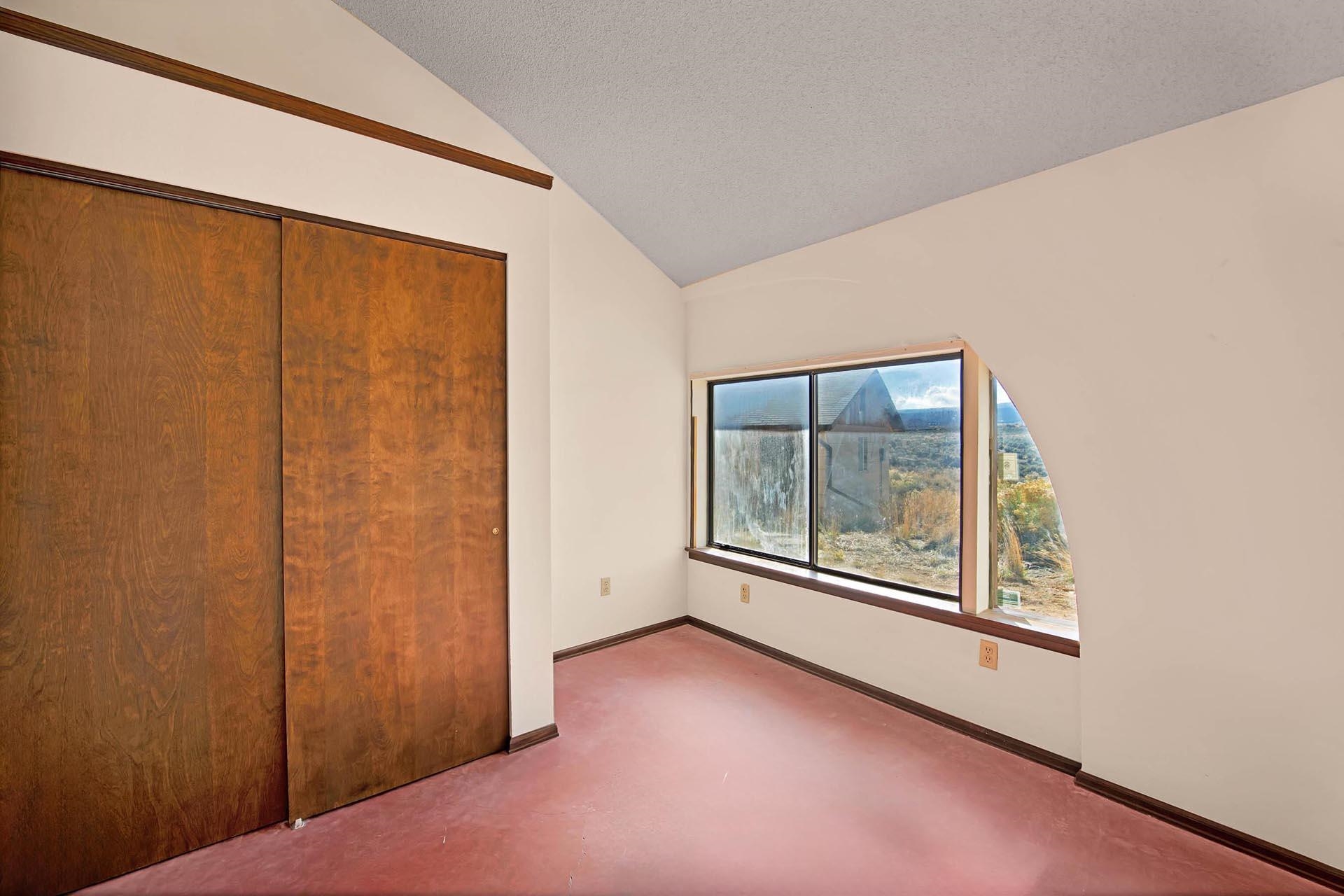 1041 South 16 1/2 Road Glade Park, CO 81523 - Photo 17 of 42 an empty room with windows