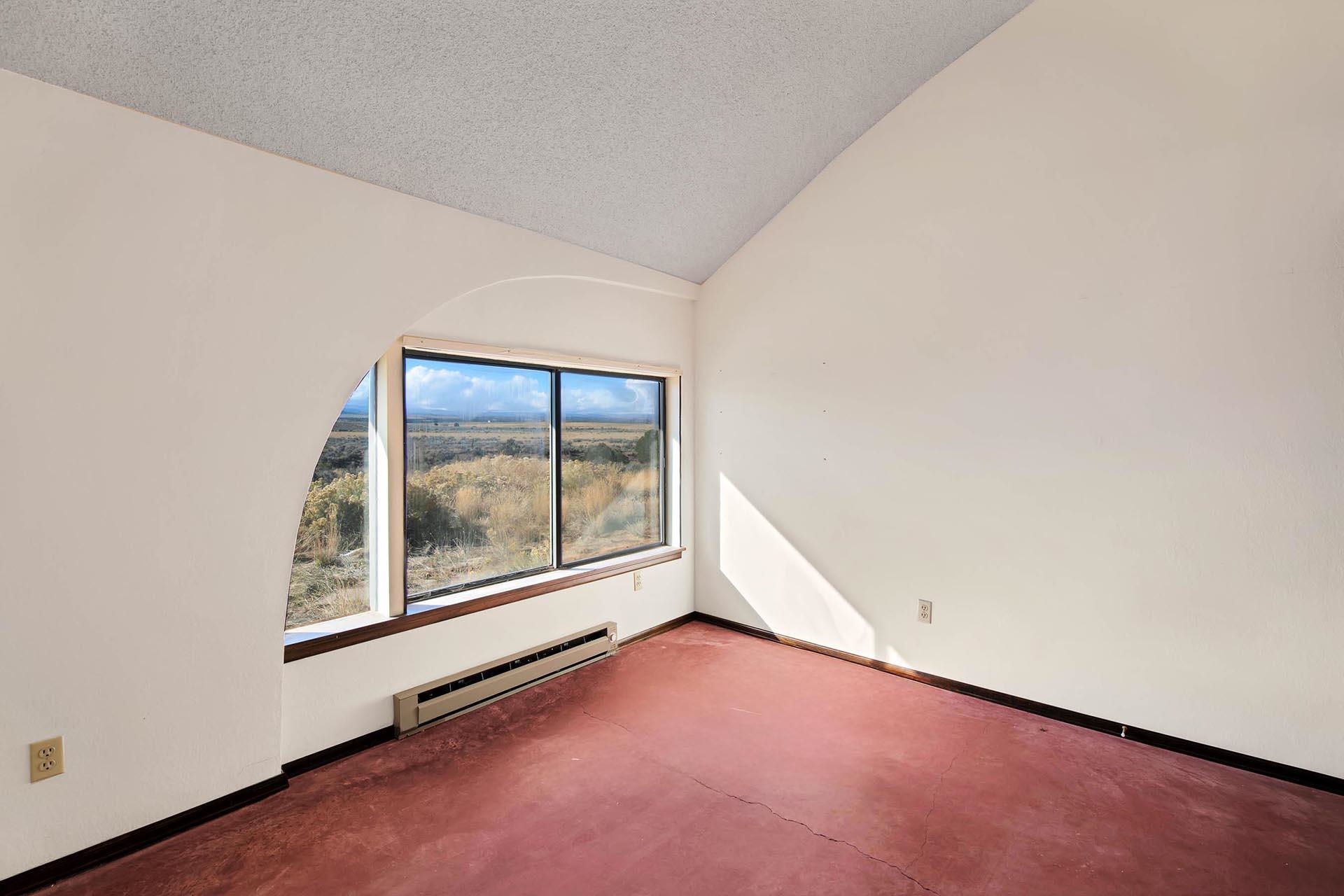 1041 South 16 1/2 Road Glade Park, CO 81523 - Photo 22 of 42 an empty room with windows