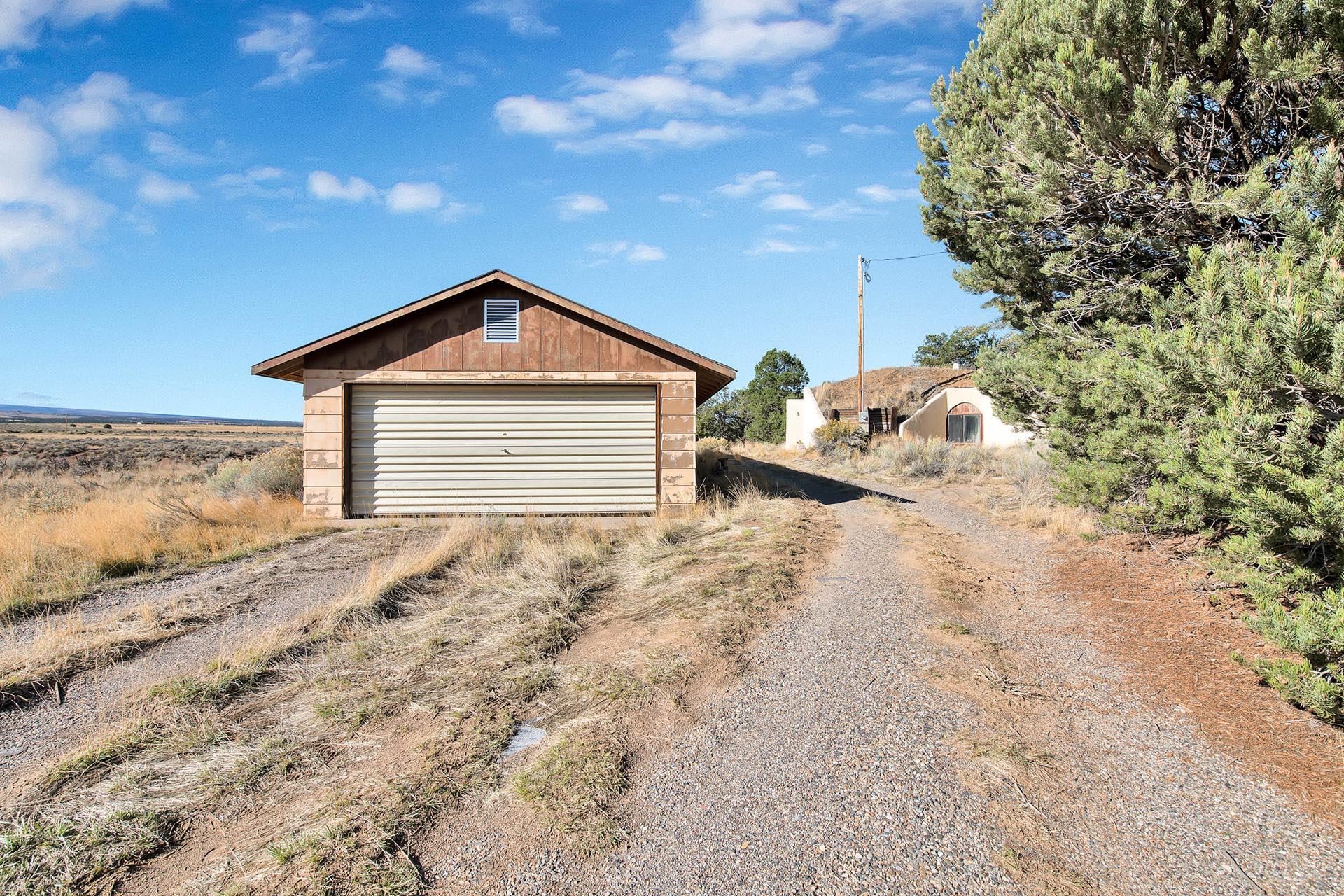 1041 South 16 1/2 Road Glade Park, CO 81523 - Photo 24 of 42 a front view of a house with a yard