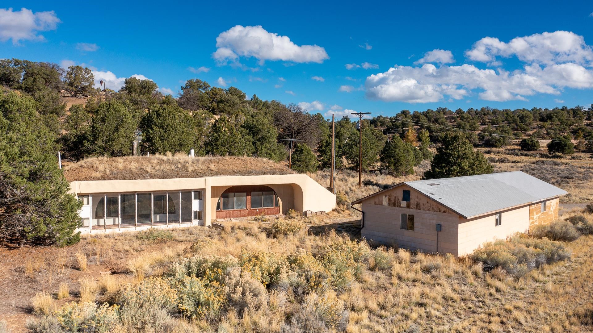 1041 South 16 1/2 Road Glade Park, CO 81523 - Photo 37 of 42 a view of a house with a yard and sitting area