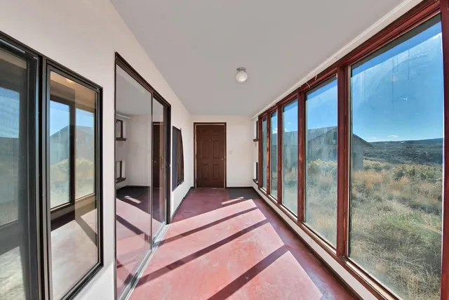 a view of an empty room and window