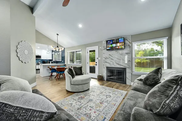 a living room with furniture and a fireplace