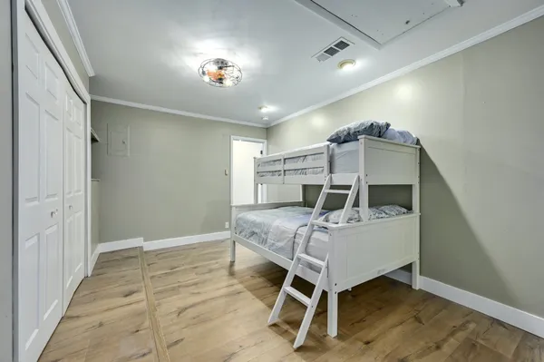 a bed room with a bed and a ceiling fan