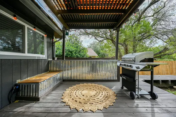 a view of a chair and table in the balcony