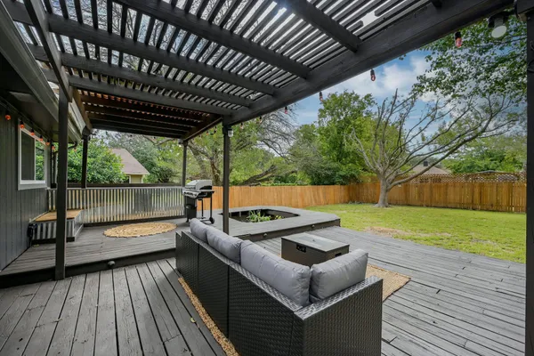 a view of a couches on wooden deck