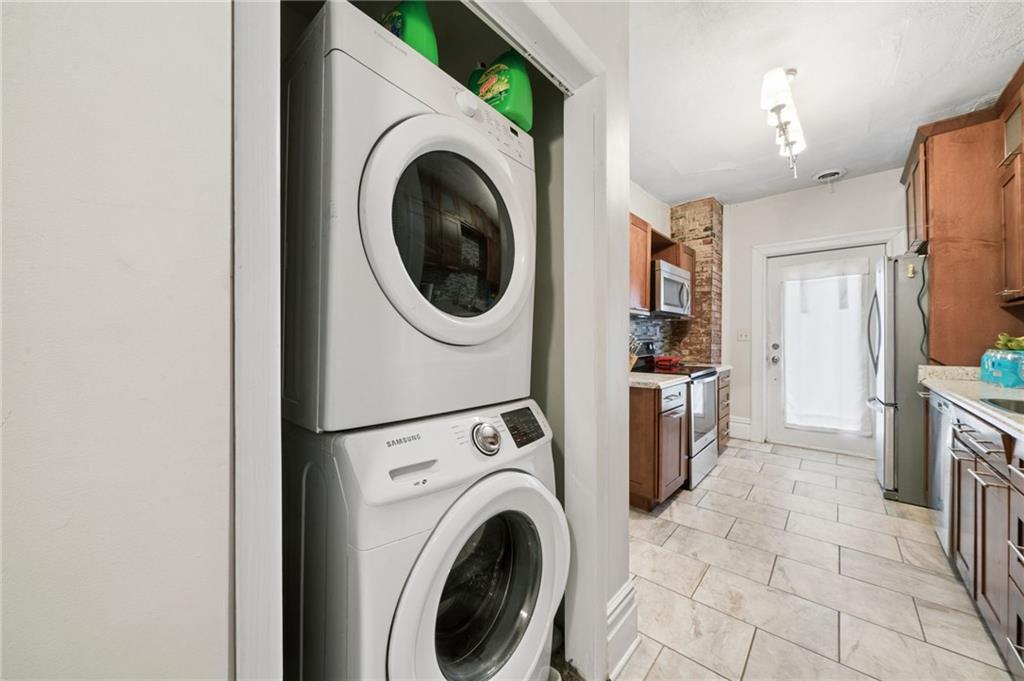 1523 Evergreen Road Pittsburgh, PA 15209 - Photo 29 of 35 a view of a hallway with washer and dryer