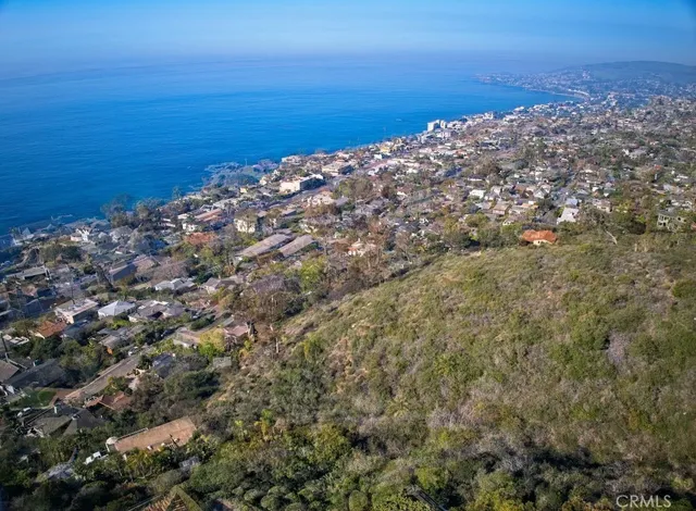 a view of a large body of water with a building in the background