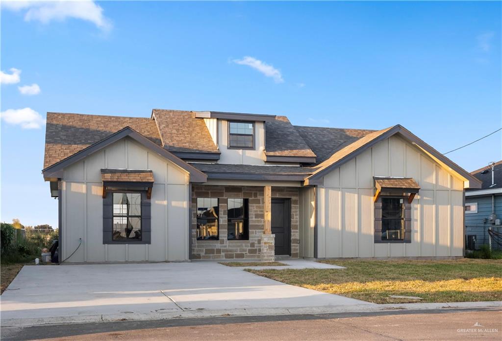 a view of a house with a swimming pool and wooden fence