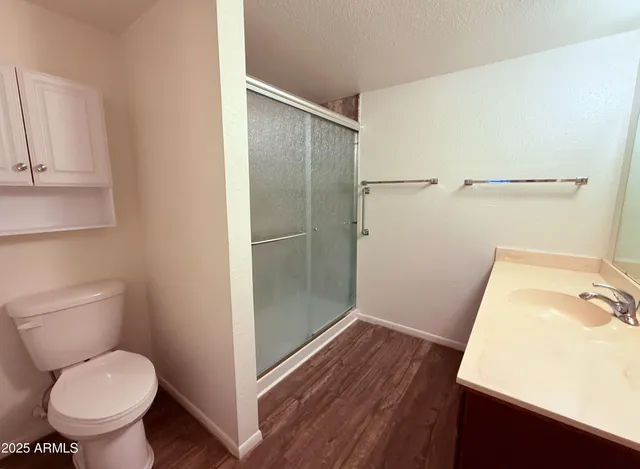 a bathroom with a toilet and a sink