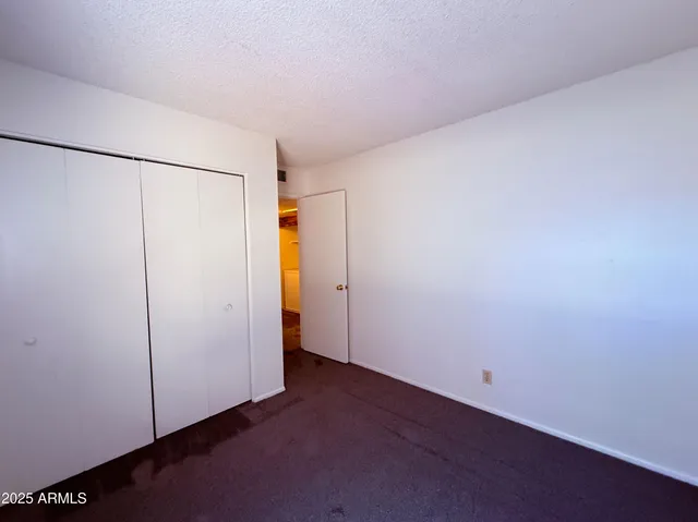 an empty room with closet