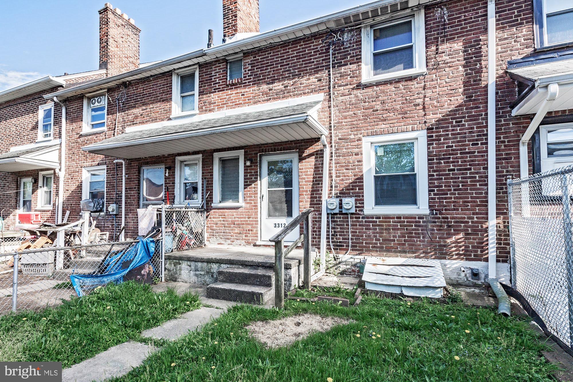 3312 West 13th Street Chester, PA 19013 - Photo 13 of 13 a view of a house with a yard and sitting area
