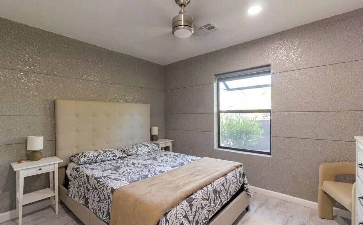 4214 North 20th Street Phoenix, AZ 85016 - Photo 16 of 40 a bedroom with a bed and a chair