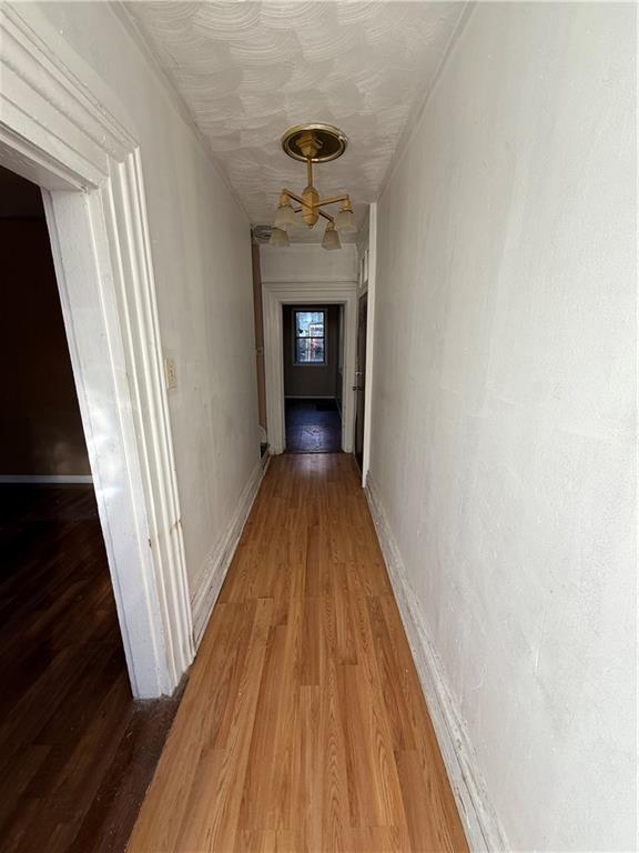516 Armandale Street Pittsburgh, PA 15212 - Photo 4 of 17 a view of a hallway view with wooden floor and staircase