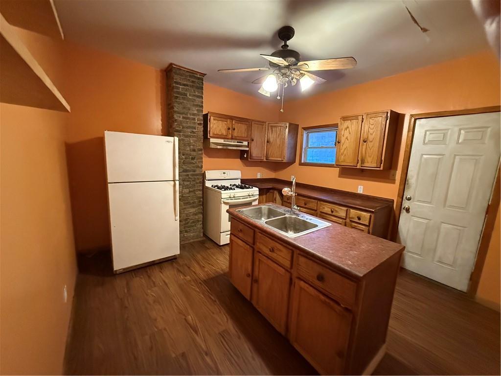 516 Armandale Street Pittsburgh, PA 15212 - Photo 7 of 17 a kitchen with sink a refrigerator and wooden floor