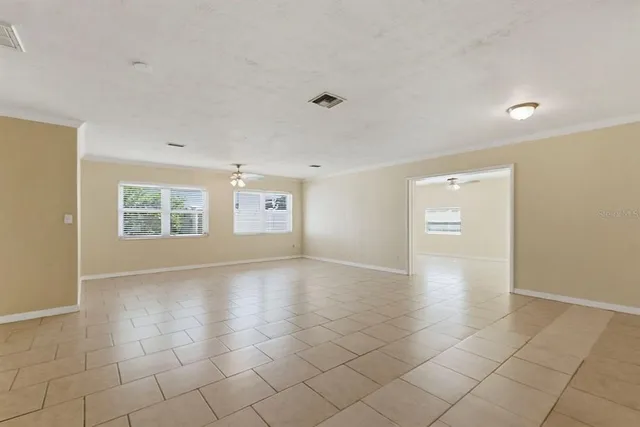 a view of an empty room with glass door