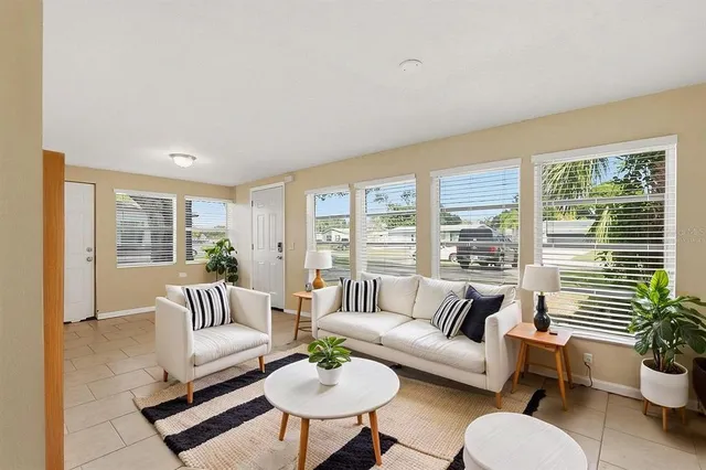 a living room with furniture and a large window