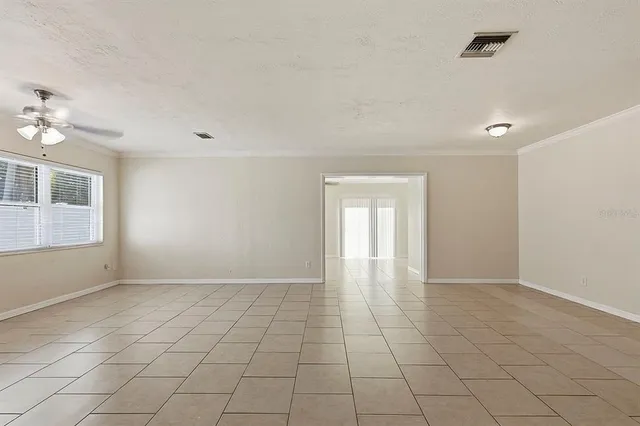 a view of an empty room with a window