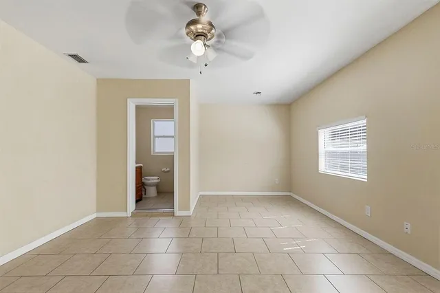a view of an empty room with a bathroom