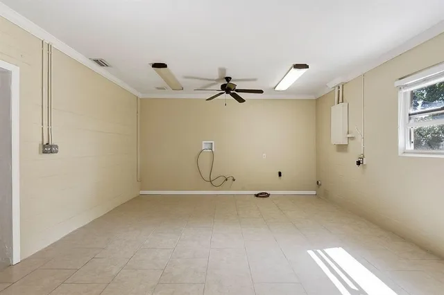 a view of a yard with wooden fence