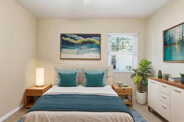 a bedroom with bed and window