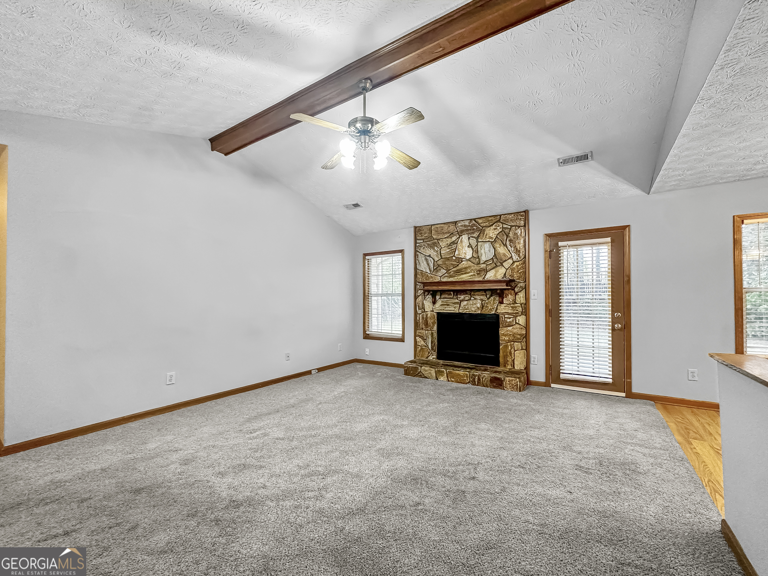 290 Cornwallis Way Fayetteville, GA 30214 - Photo 4 of 18 a view of a livingroom with a fireplace and window