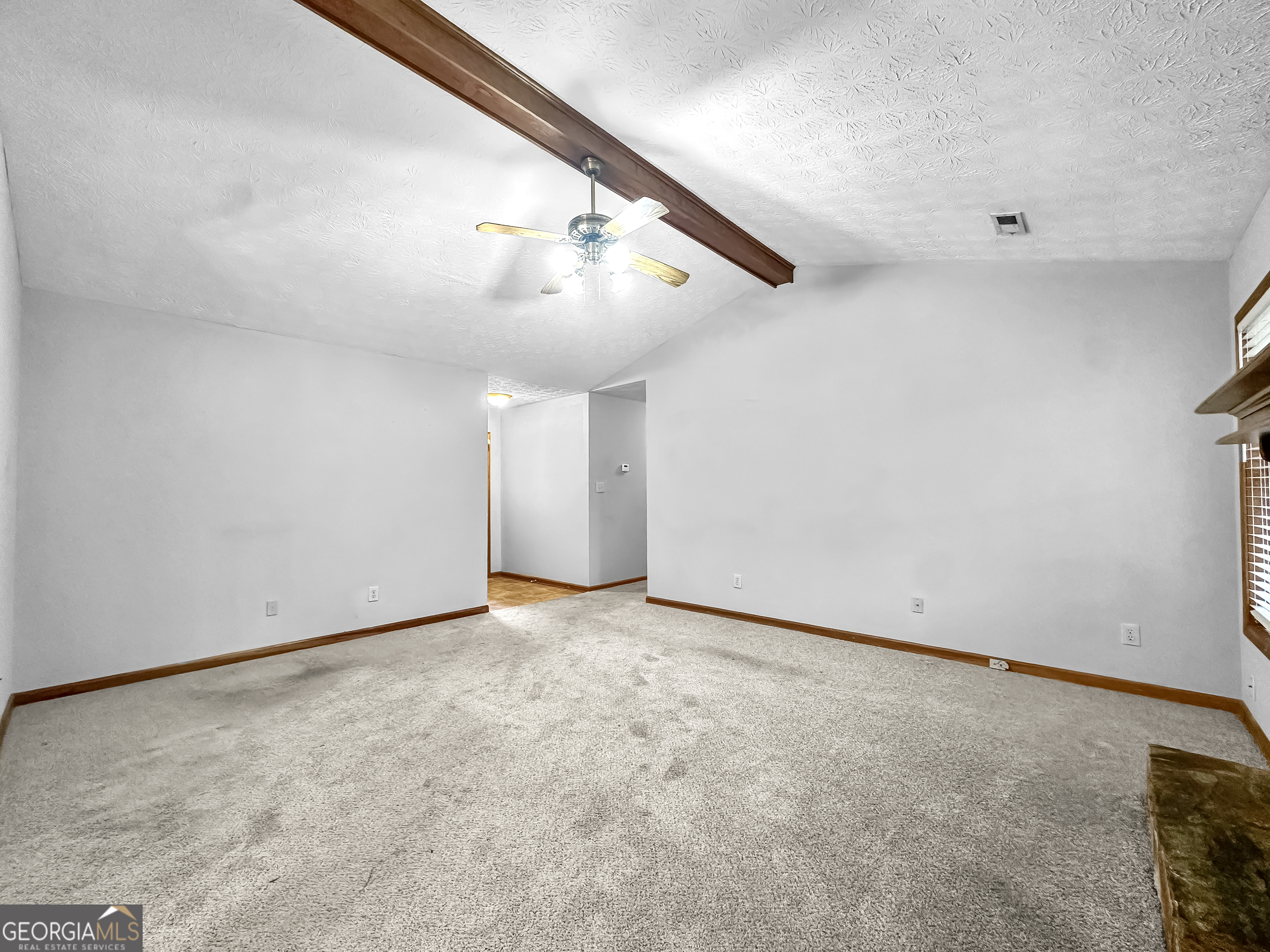 290 Cornwallis Way Fayetteville, GA 30214 - Photo 5 of 18 a view of an empty room with stairs
