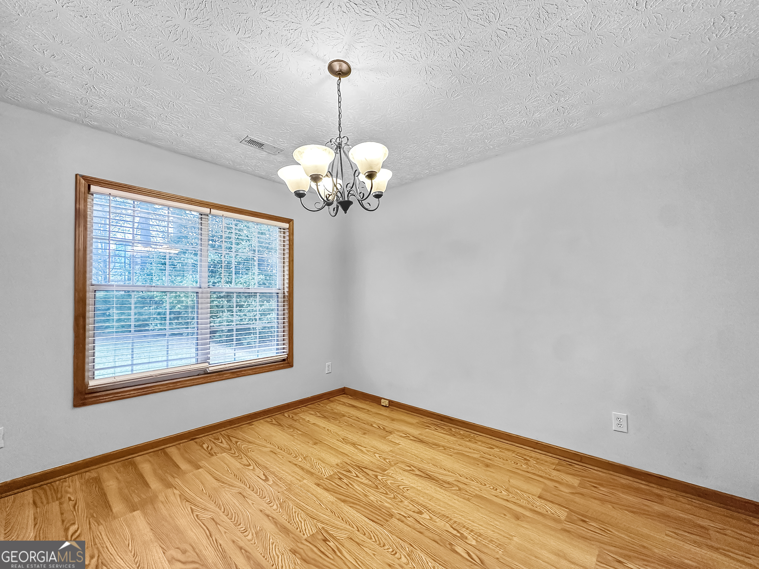 290 Cornwallis Way Fayetteville, GA 30214 - Photo 6 of 18 a view of empty room with wooden floor