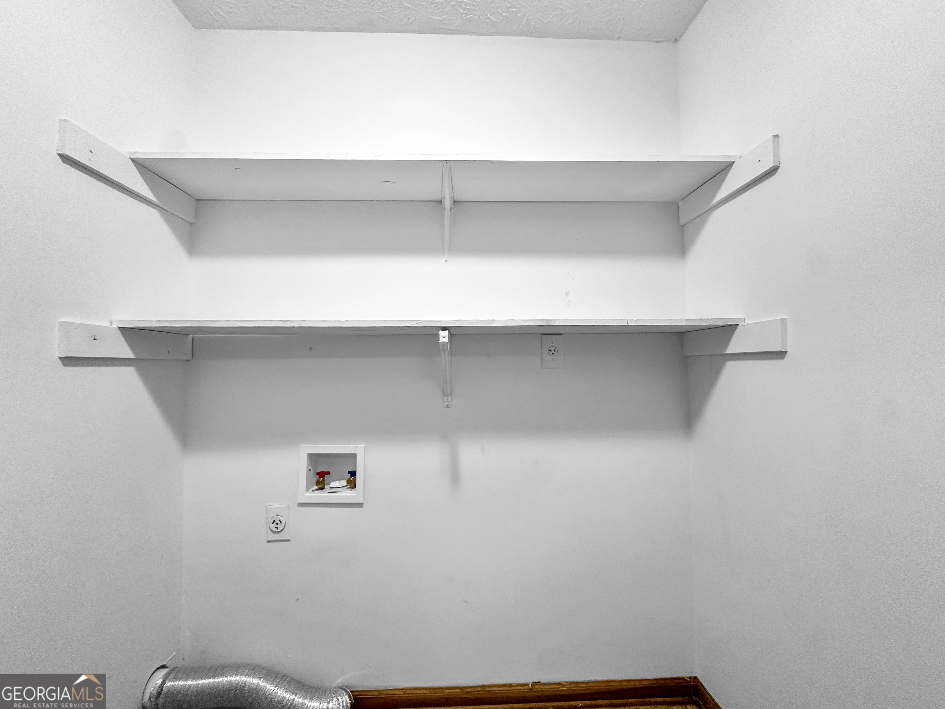 290 Cornwallis Way Fayetteville, GA 30214 - Photo 8 of 18 a view of small space with racks on the wall